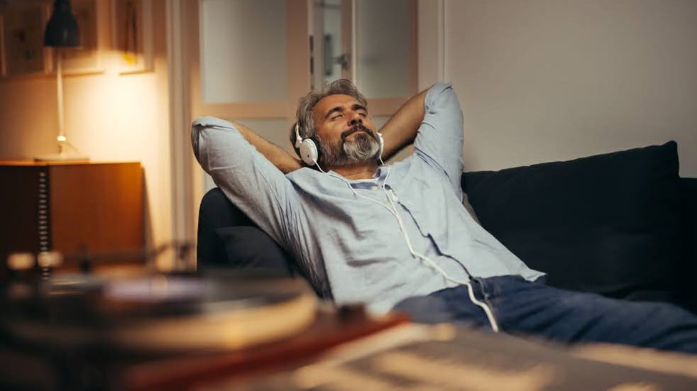 Man relaxing with headphones on